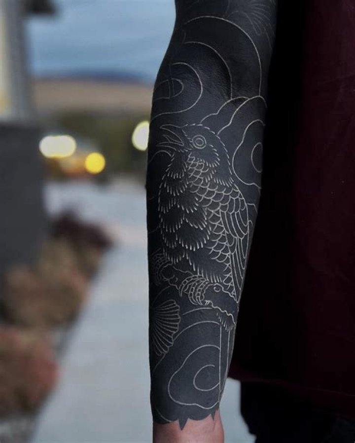 Can you put white ink on a black tattoo?