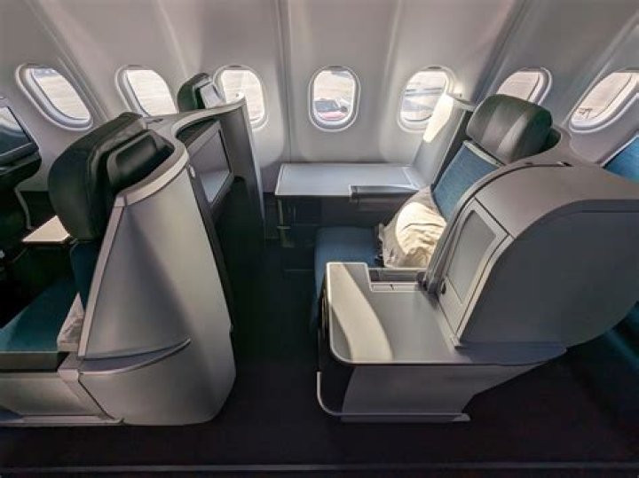 How do first class upgrades work on Alaska