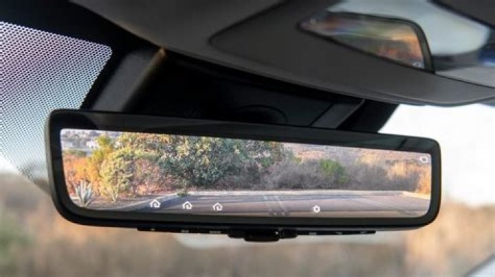 How do I reprogram my rear view mirror?