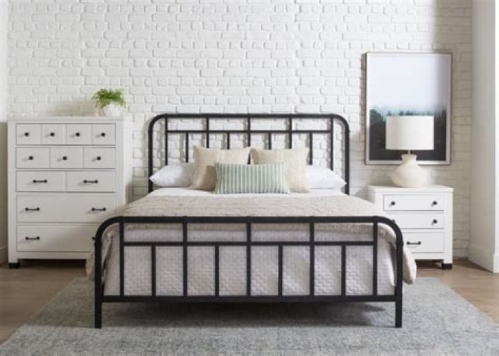 How do you decorate a room with a metal bed?