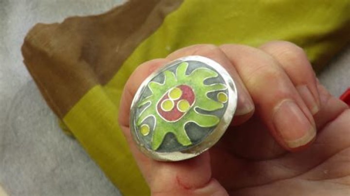 How do you paint enamel on metal jewelry