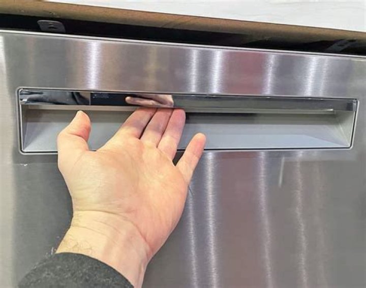 How do you put an anti tip bracket on a dishwasher?