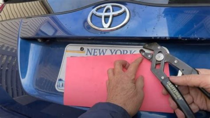 How do you remove rust from license plate screws?