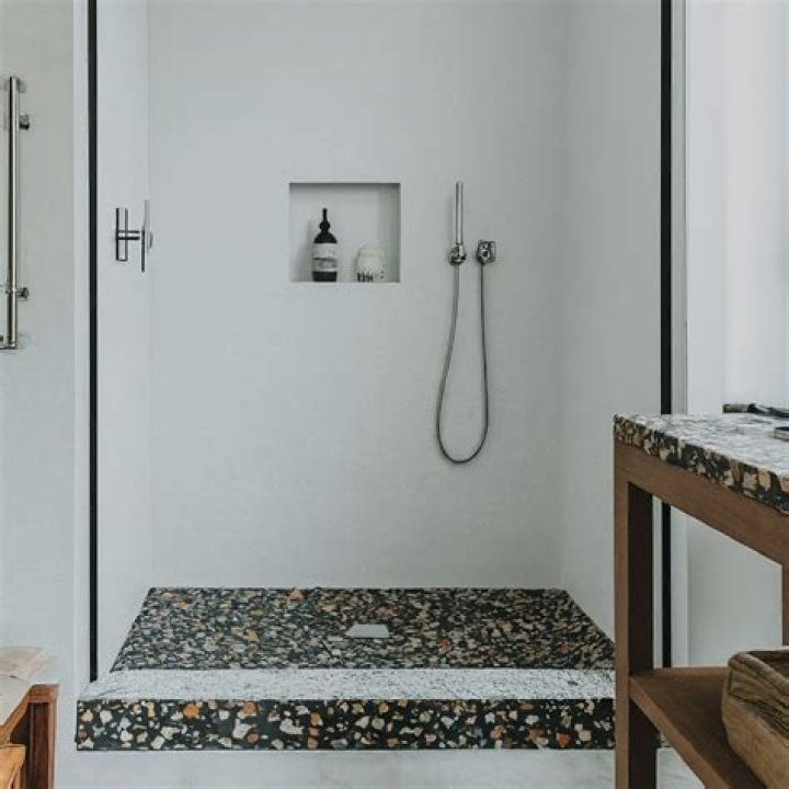 How do you resurface a terrazzo shower base