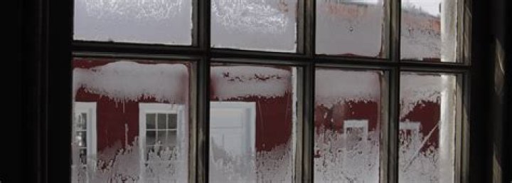 What causes frost on storm windows