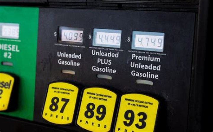 What should you do if you spill gas at the gas station?