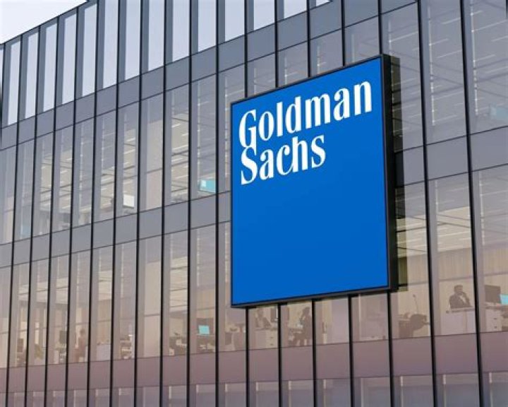 Why did Goldman Sachs become a bank holding company?