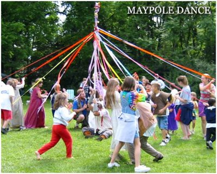 Why do people dance around the Maypole